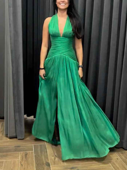 Emerald Green Plunging Neckline Gown With Pleated Skirt And Side Slit