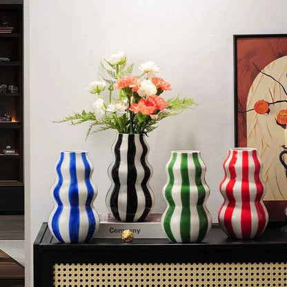Modern niche minimalist striped vases, flower arrangements in them, high-end sense, creative retro painted ceramic vases