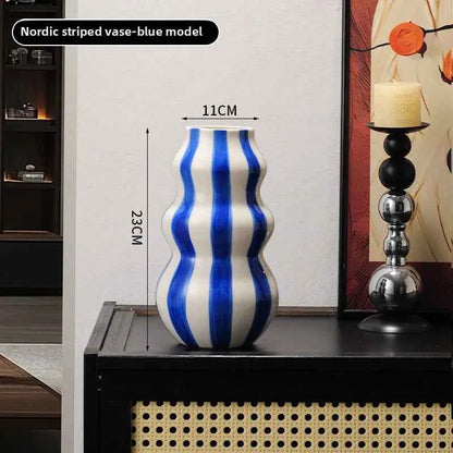 Modern niche minimalist striped vases, flower arrangements in them, high-end sense, creative retro painted ceramic vases