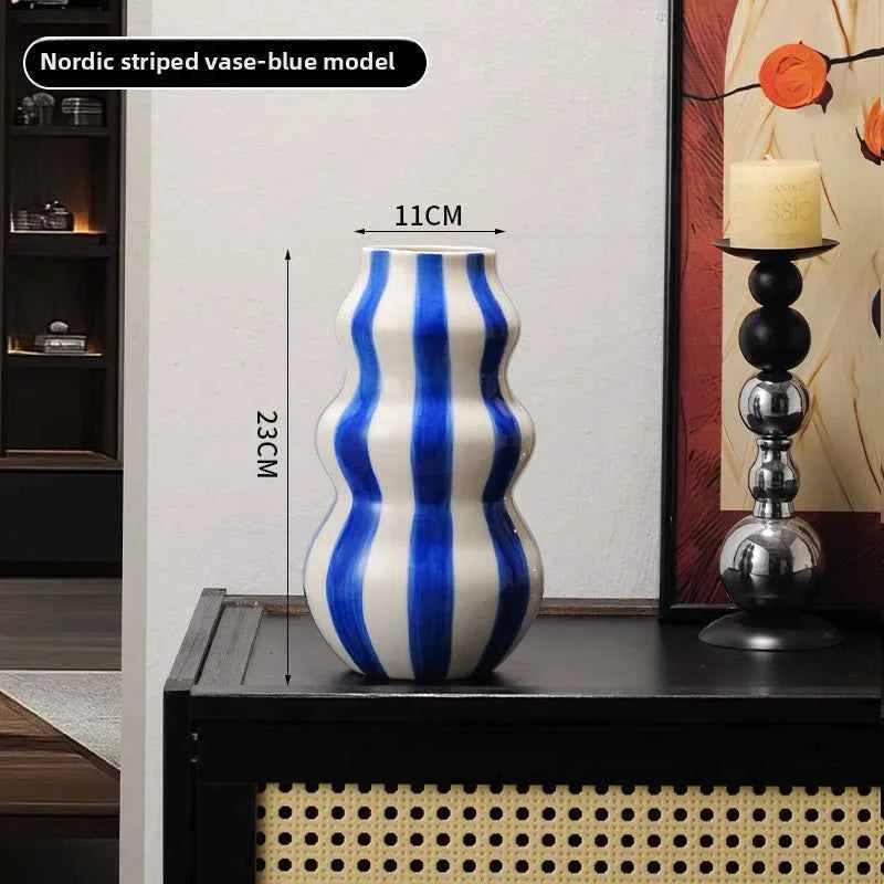Modern niche minimalist striped vases, flower arrangements in them, high-end sense, creative retro painted ceramic vases