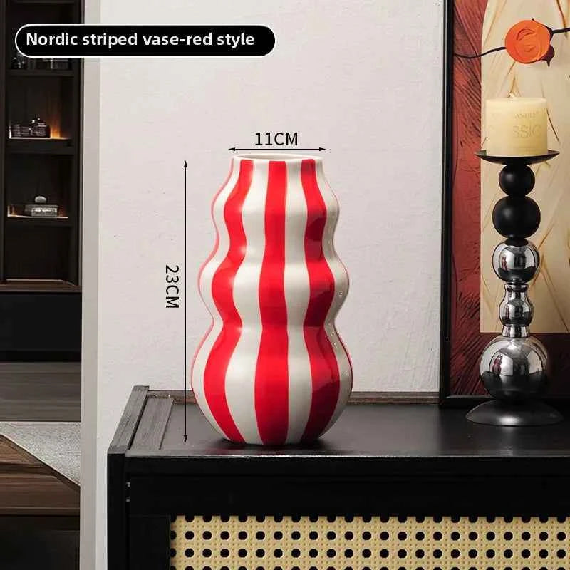 Modern niche minimalist striped vases, flower arrangements in them, high-end sense, creative retro painted ceramic vases
