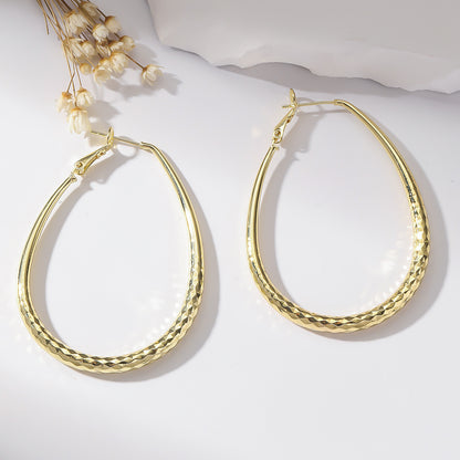 Golden Glossy Spring Fastener Egg-shaped Earrings Hypoallergenic Copper - DropOnline.co